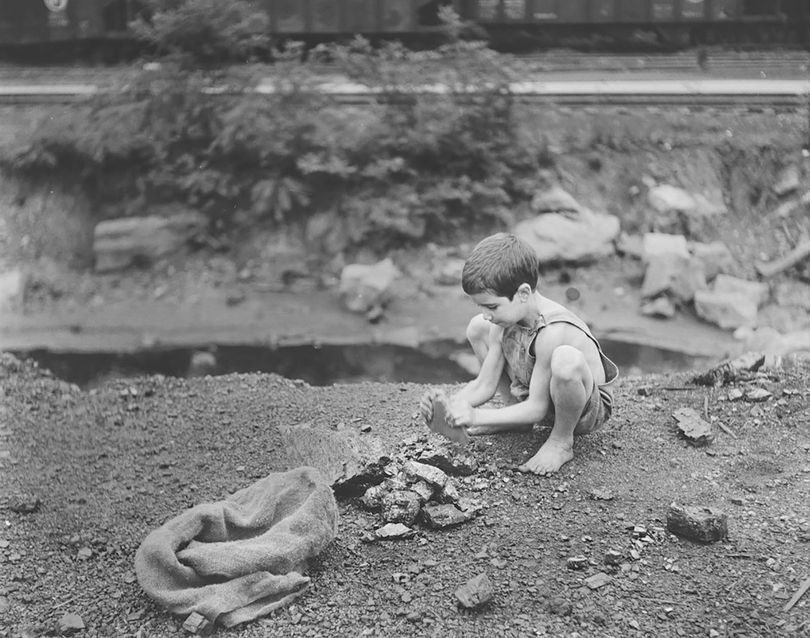 boy breaking coal 1930s